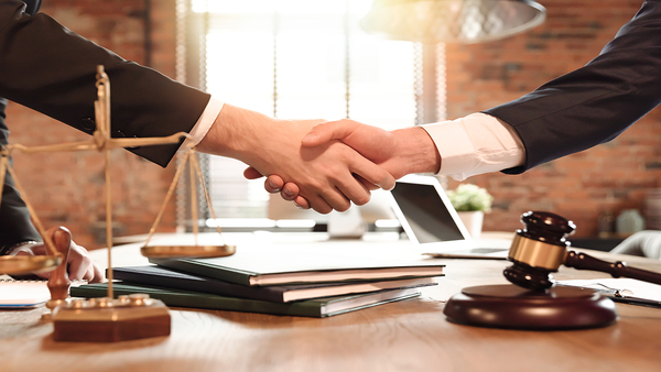 lawyer and his client handshak 325228753